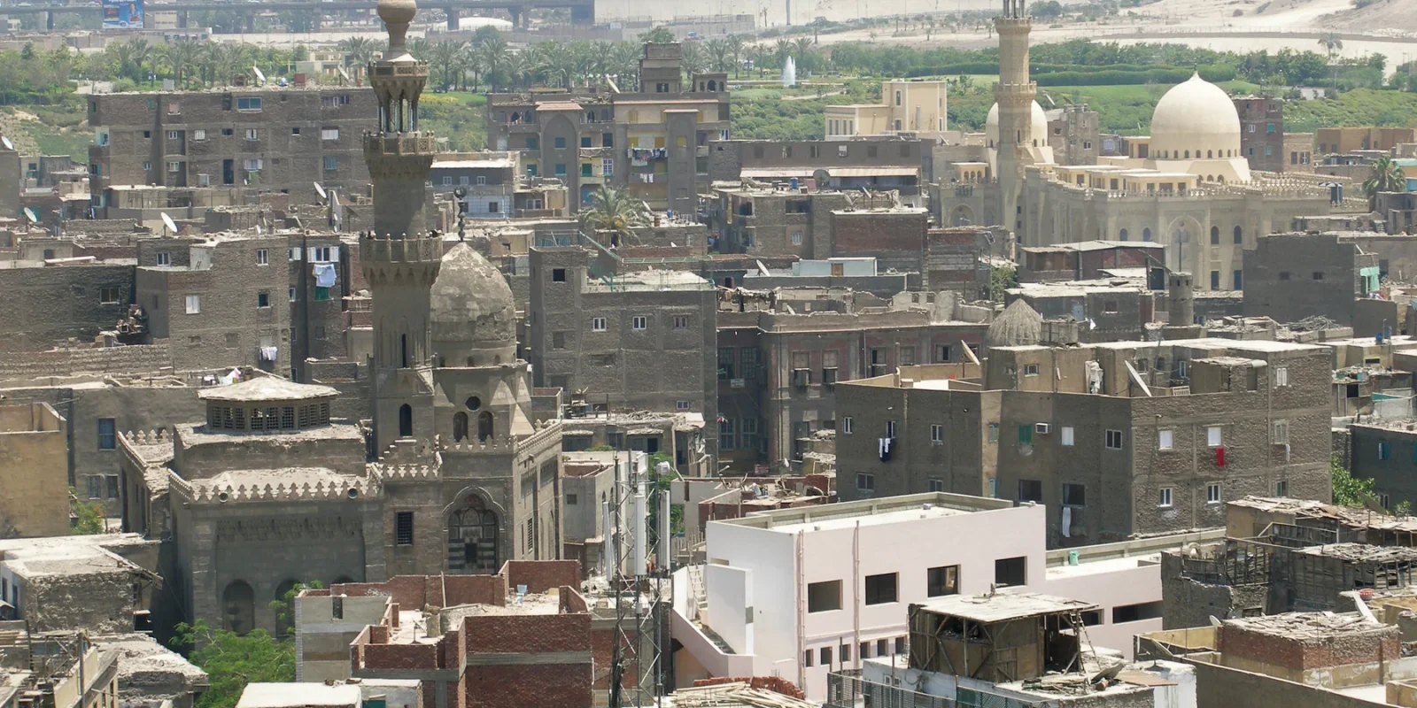 Stone minarets and dense buildings in Islamic Cairo seen from Bab Zuwayla