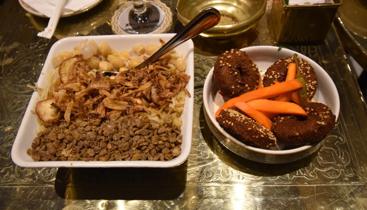 Koshary and falafel served on a Cairo café table
